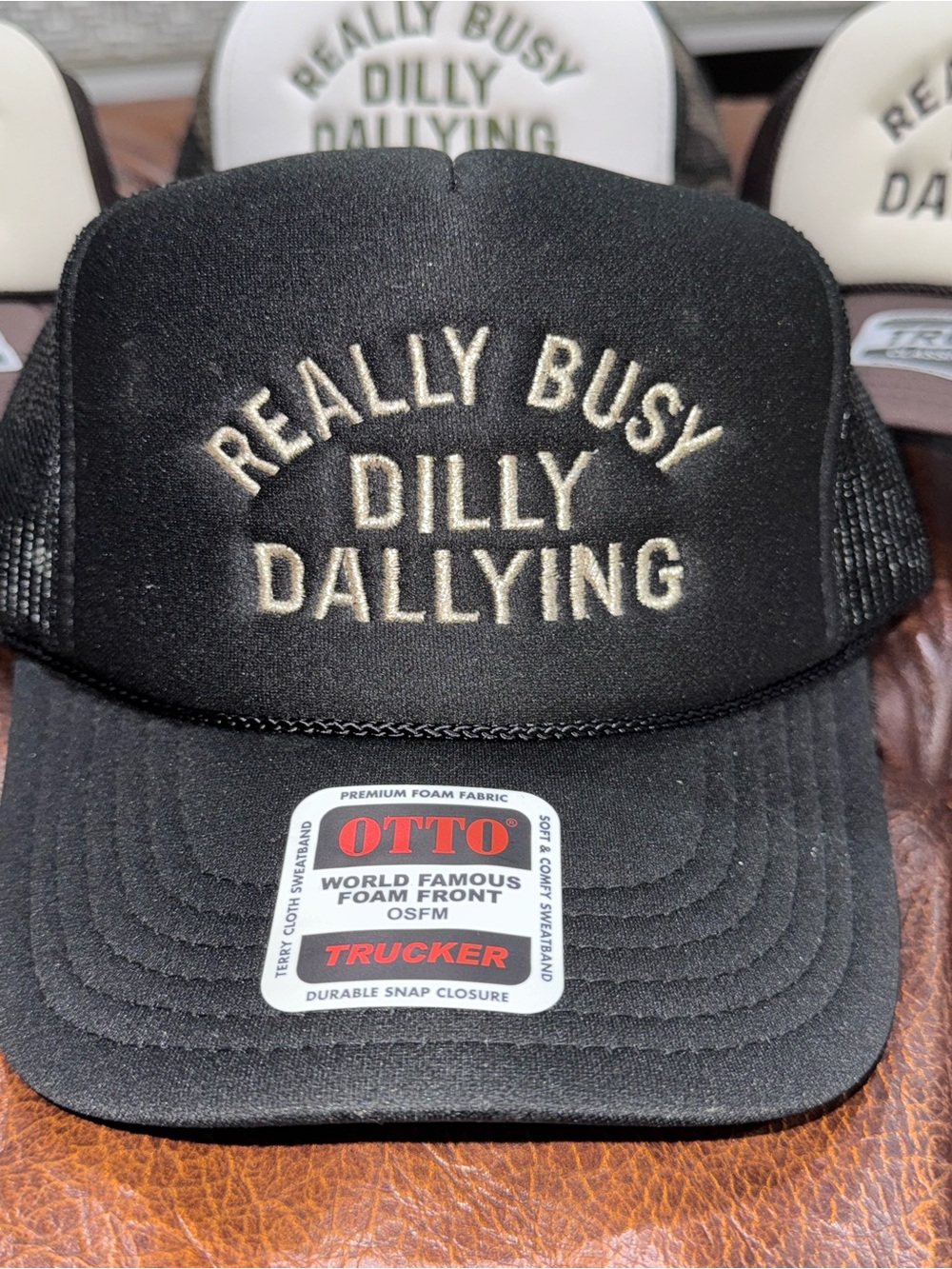 OTTO Black Trucker Hat with Cream Embroidered 'Really Busy Dilly Dallying'